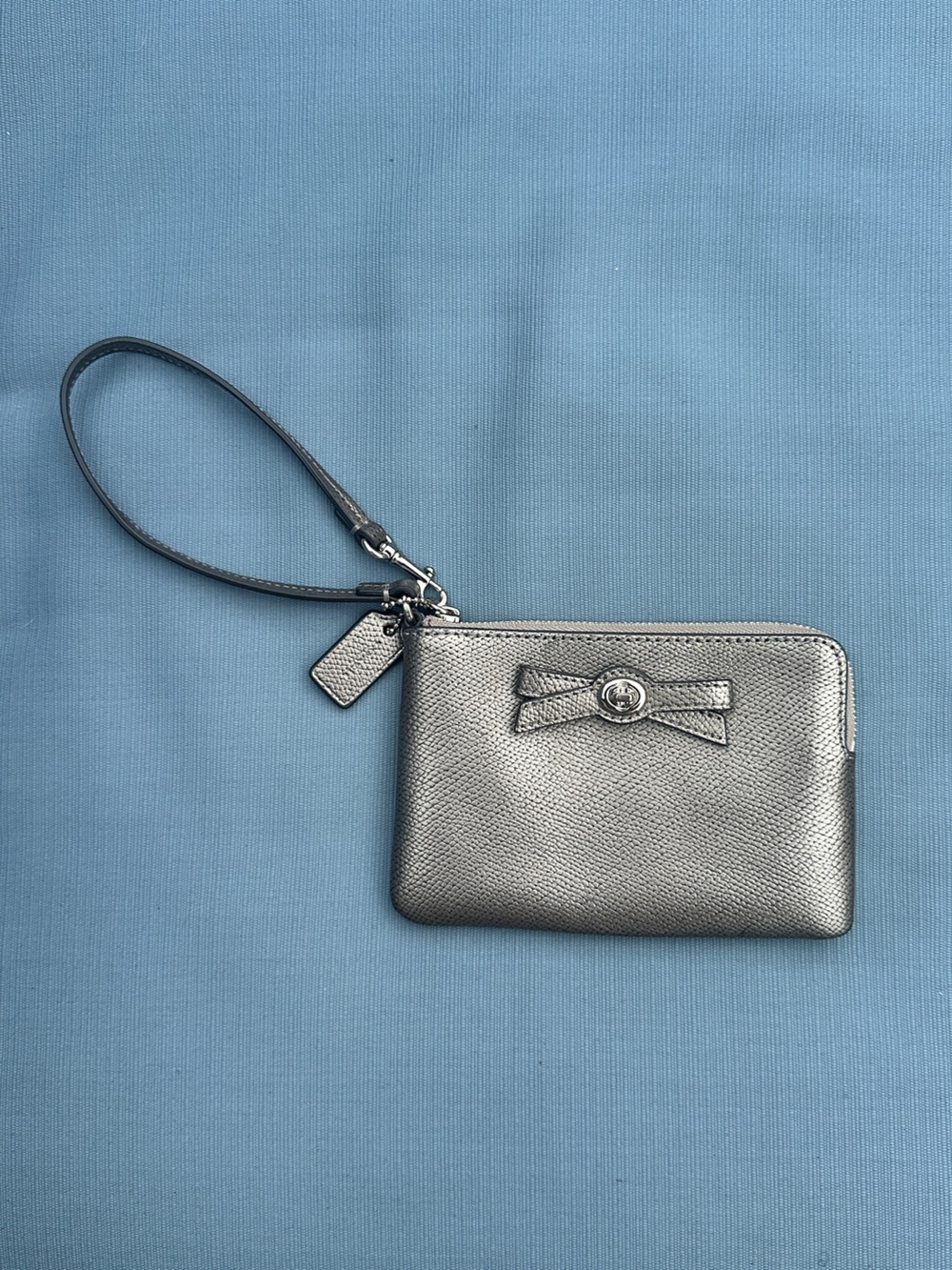 Coach Metallic Silver Wristlet with Bow Accent
